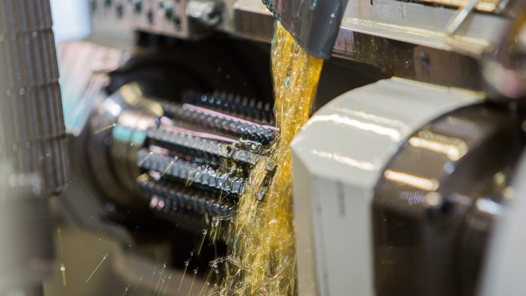 Machine with rotating part doused by yellow liquid